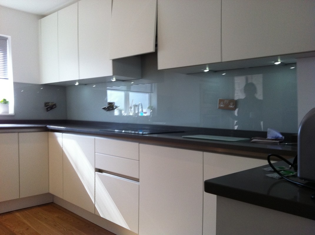 Grey glass kitchen splashback with LED lighting in East Molesey
